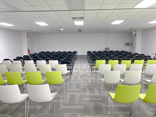 Empty clean room with chairs and tables for training,meeting 