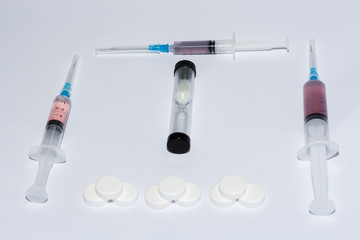 tablets and syringe on white background isolate