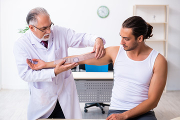 Young male patient visiting experienced doctor
