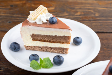 A slice of cake with blueberries.
