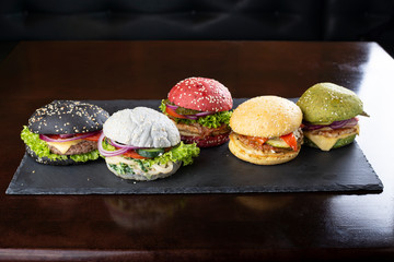 Set of multi-colored delicious hamburgers.