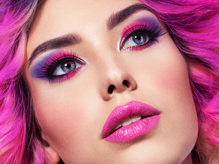 Portrait of beautiful young woman with bright pink makeup. Beautiful blonde with bright pink...