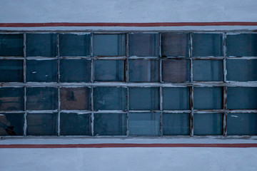 the background of the four rows of thick glass bricks