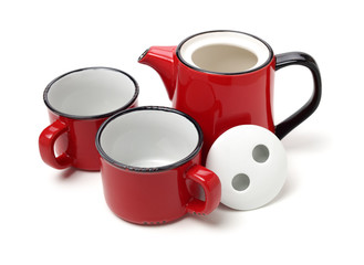 Red teapot and cups on white background