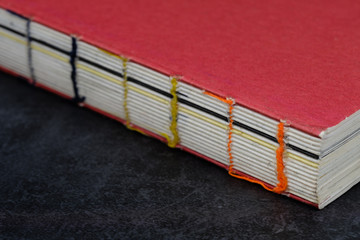 vintage style red cover wire-bound book closeup view