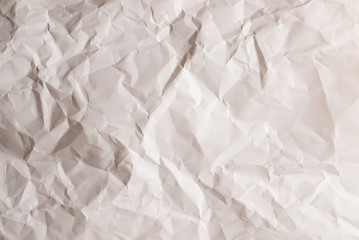 Crumpled white paper background.