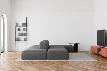 White living room interior with sofa and TV