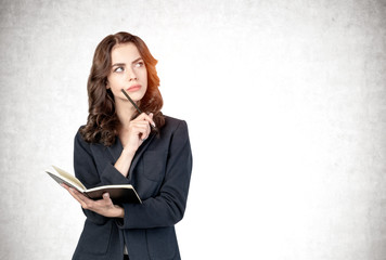 Thoughtful businesswoman with notebook, mockup