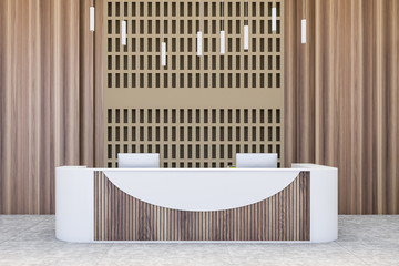 White and wooden reception desk in office