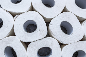 Background of white toilet paper rolls . Top view.