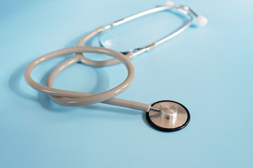 Medical stethoscope on a blue background. Healthcare concept.
