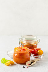 Vegetarian preserves, mixed vegetable salad in glass jar. Selective focus, copy space.