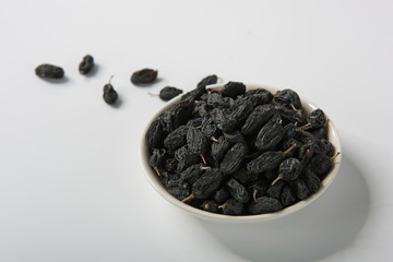 Raisins of all colors mixed and dried in isolation on a white background