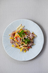 Tuna ceviche with coconut milk, mango, chilli and lime juice