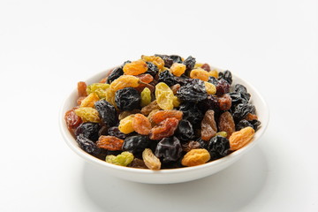 Raisins of all colors mixed and dried in isolation on a white background