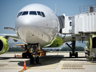 The plane is waiting for passengers in the airport.