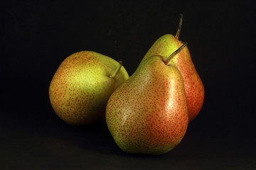 Pears on black background