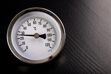 Technical thermometer for temperature measurement. Clock scale for temperature reading.