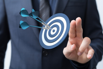 Dart arrow on target dartboard, Business success concept..