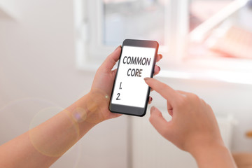 Text sign showing Common Core. Business photo showcasing set of academic standards in mathematics and English language