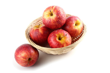 Gala apples on wicker plate