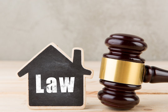 Real estate tenancy law concept -gavel and house model