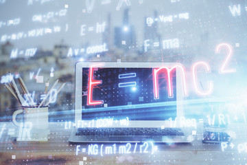 Desktop computer background and formula hologram writing. Double exposure. Education concept.