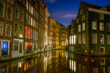 Amsterdam nightscape - Night reflections on Amsterdam canals. Sint Olofssteeg