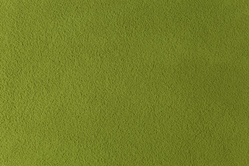 A textured green background for food and drink created from Matcha tea powder