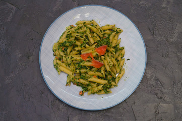 Delicious traditional Italian dish pasta with salmon, spinach and cheese.