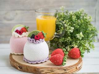Knitted cakes. Concept. Sweet tooth.Stylization. Needlework. Environmentally friendly toys for children to develop fine motor skills. Hand made toys. 