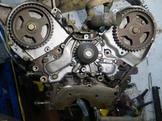 The connecting rod, piston and cylinder block in a disassembled condition