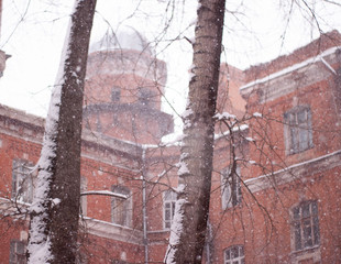 old red brick houses in heavy snowfall