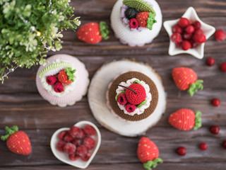 Knitted cakes. Concept. Sweet tooth.Stylization. Needlework. Environmentally friendly toys for children to develop fine motor skills. Hand made toys. 
