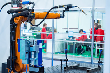 Robotics. Robotic arm on the background of a robotics training class. Computer programming of...