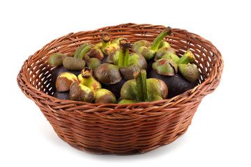 Mangosteen fruits on wicked plate