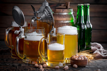 Light beer in a glass, on an old background.