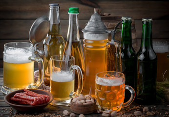 Light beer in a glass, on an old background.