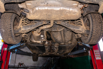 Bottom view of the car for scheduled maintenance at the bus station lift