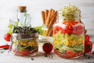Vegan salad in with microgreens in a jar