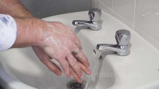 Coronavirus disease - Young man washing hands to happy birthday