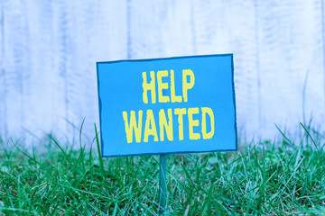 Conceptual hand writing showing Help Wanted. Concept meaning An ad in the paper an employer places...