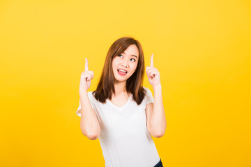 woman teen standing makes gesture two fingers point upwards above