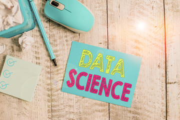 Writing note showing Data Science. Business concept for multidisciplinary field that uses...