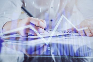 Multi exposure of man planing investment with stock market forex chart.