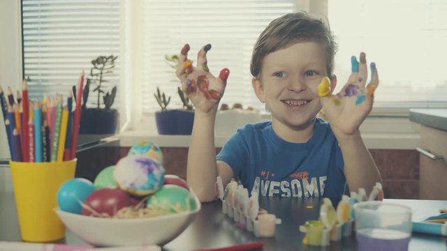 Little Boy Painting Easter Eggs
