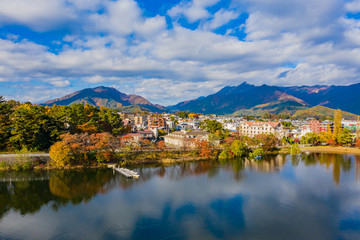 Fototapeta na wymiar Japan. Kawaguchiko Lake. Resorts by the lake. Five Fuji Lakes. Hotels overlooking Mount Fuji. Fujikawaguchiko. Autumn day in Japan. Japanese nature. Traveling in Japan. Fujikawaguchiko Tourism.