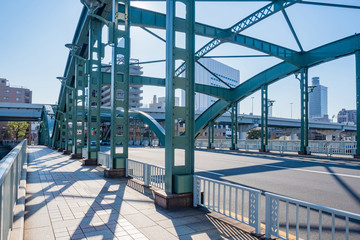 Fototapeta premium Japan. Tokyo. Iron-concrete bridge close up. Sidewalk. Road architecture in Japan. Bridge without cars in Tokyo. Bridges in the Japanese city. Highways in Tokyo. Holidays in Japan.