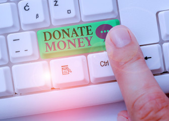 Conceptual hand writing showing Donate Money. Concept meaning to give money or goods to help a...