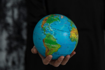 Earth globe on the hand .Precautions for corona virus.